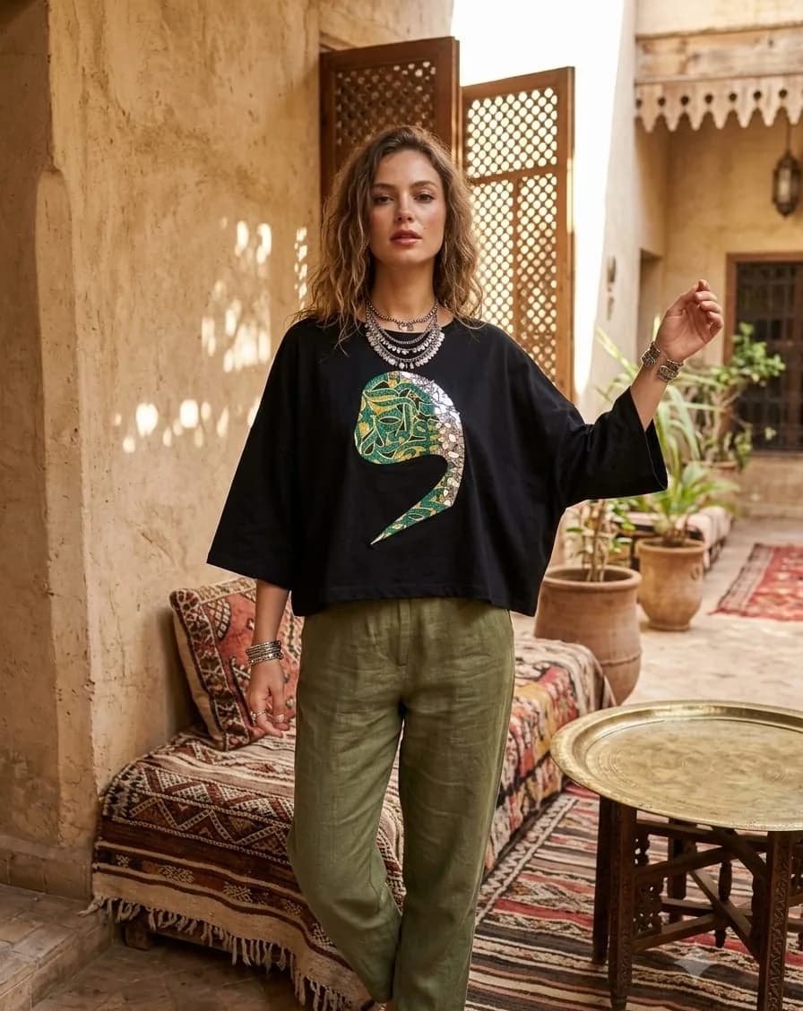 Aaina — worn, riad courtyard